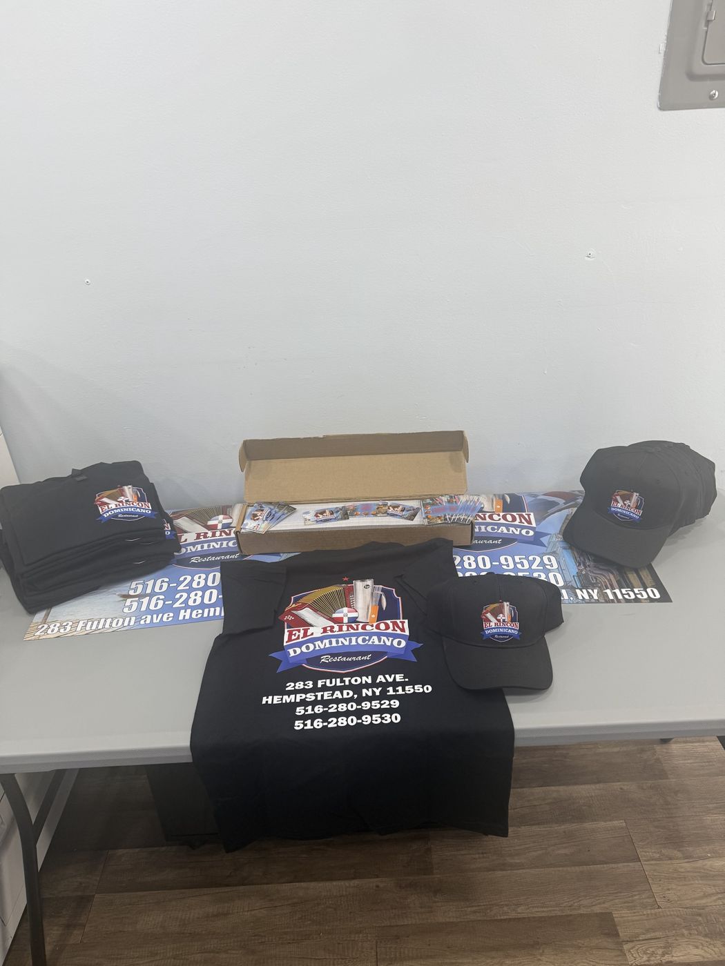 Restaurant launch kit: shirts, hats, cards and banners