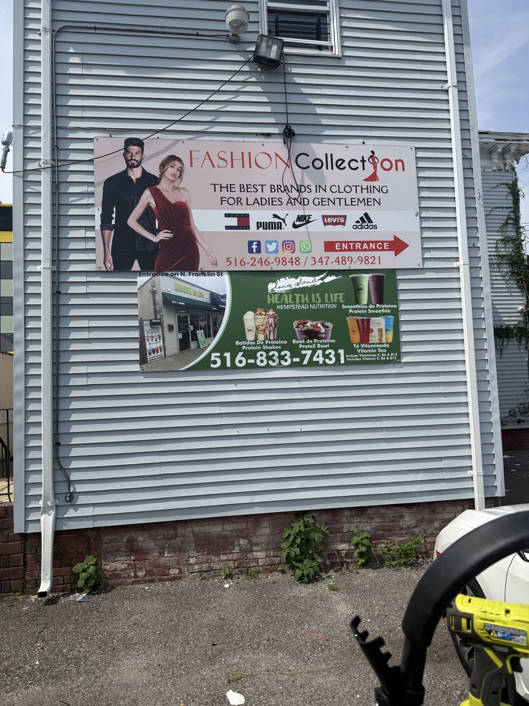Large-format banners for two Hempstead storefronts