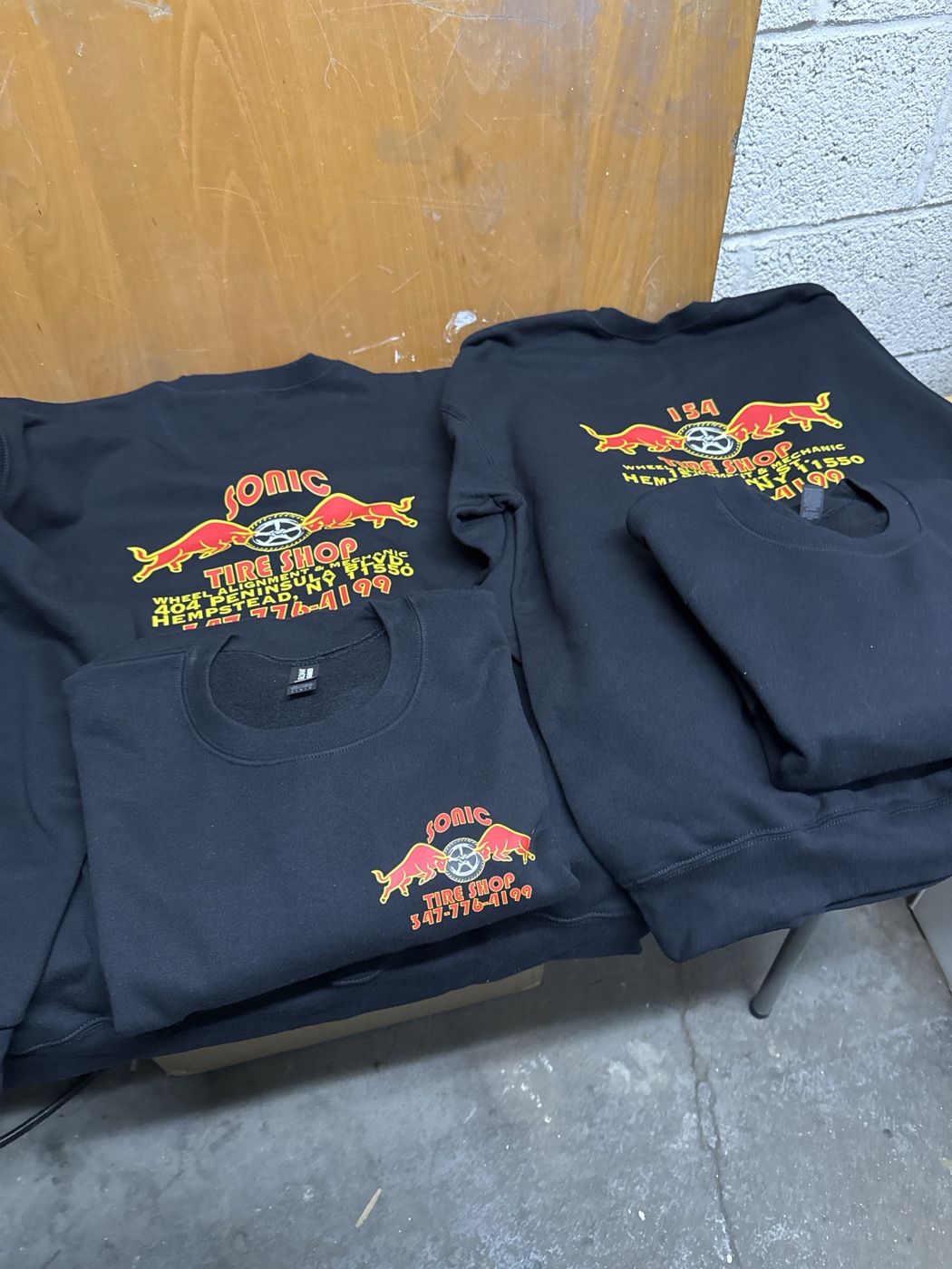 Front and back print on crew sweatshirts for a tire shop